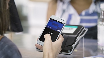 Using Visa Mobile Pay at a contactless-enabled terminal.